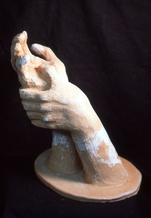 Clay sculpture of two cupped hands
