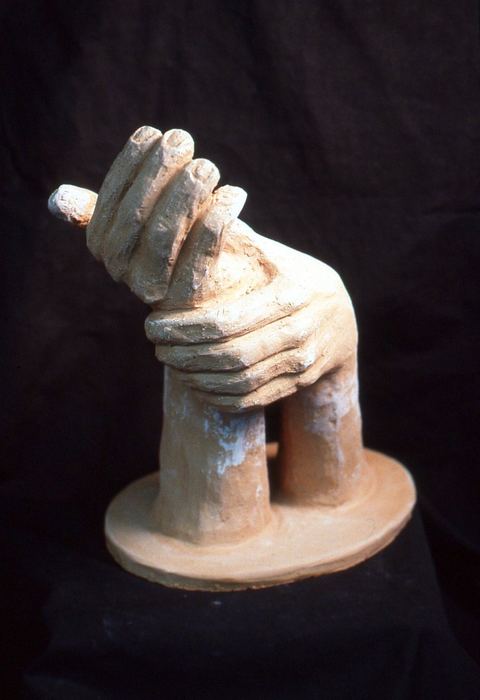Clay sculpture of a hand gripping
