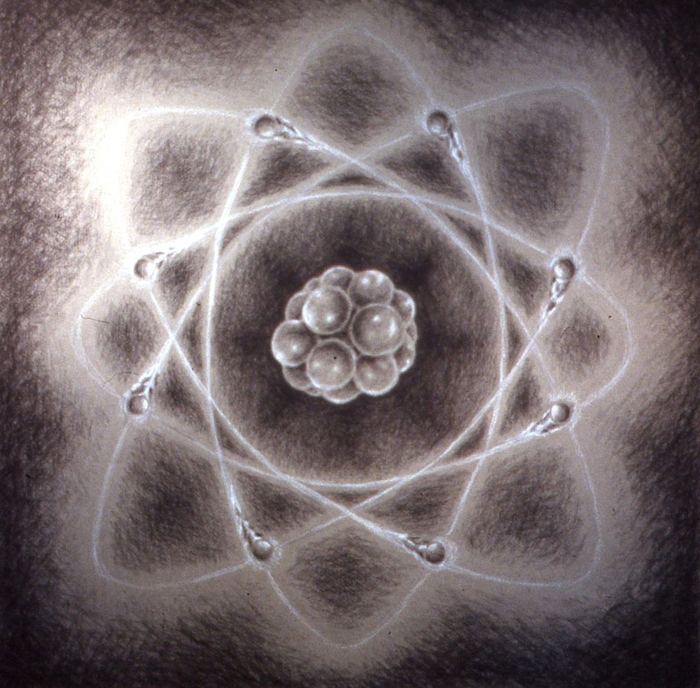 White-on-black drawing of an atom — nucleus and orbiting electrons