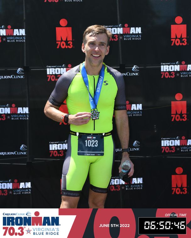 Scott Lerch with finisher medal at IRONMAN 70.3 Virginia's Blue Ridge 2022